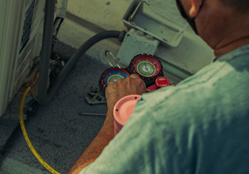 HVAC technician performing emergency air conditioning repair